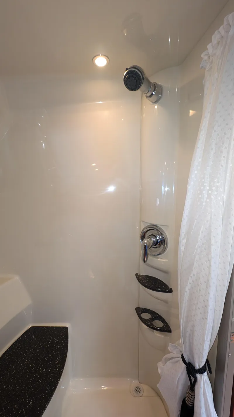 Slide: The Image of Shower area in 2007 Formula 400ss boat with modern fixtures and curtain. - 31