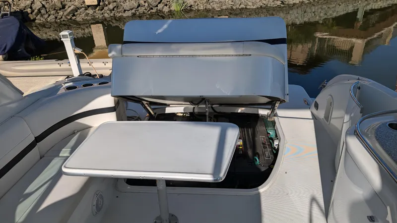Slide: The Image of 2007 Formula 400ss boat interior with open engine compartment and table. - 34