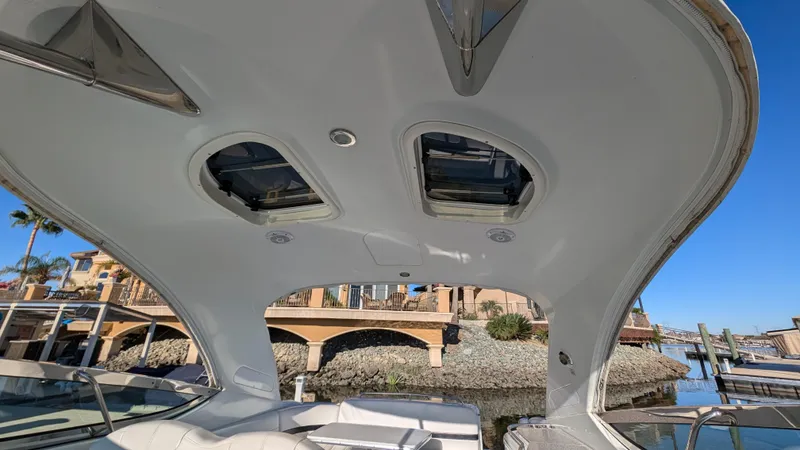 Slide: The Image of Interior view of 2007 Formula 400ss boat with sunroof and waterfront background. - 7