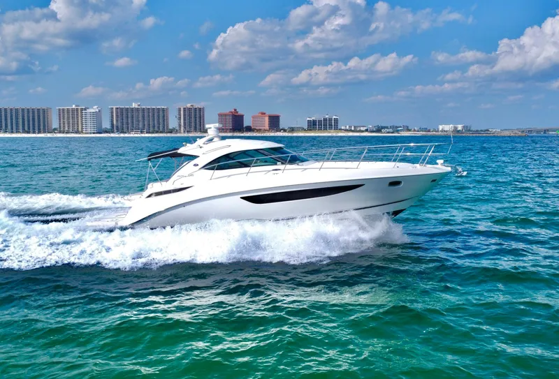 Slide: The Image of Sea Ray 410 Sundancer 2013 cruising on blue ocean near city skyline. - 1