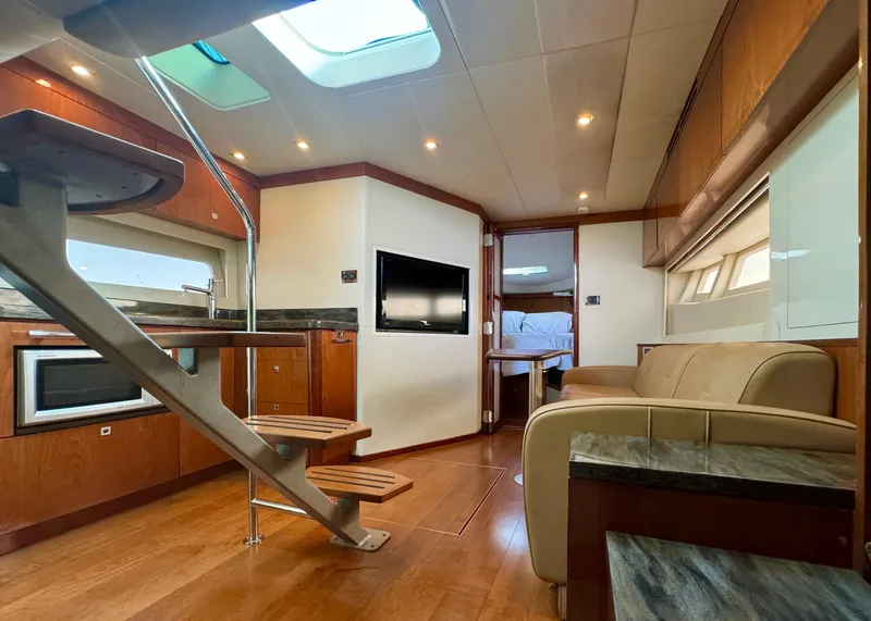 Slide: The Image of Luxurious interior of 2013 Sea Ray 410 Sundancer yacht with modern amenities and elegant design. - 21