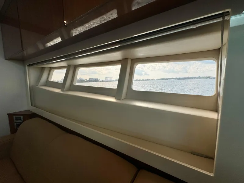 Slide: The Image of Interior view of 2013 Sea Ray 410 Sundancer yacht with scenic window. - 26