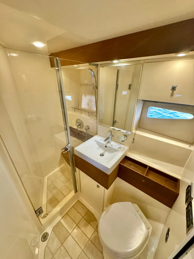 Slide: The Image of Luxurious bathroom in 2013 Sea Ray 410 Sundancer yacht with modern fixtures. - 29