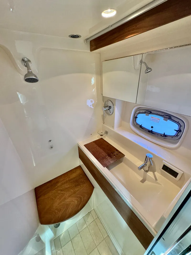 Slide: The Image of Luxurious bathroom in 2013 Sea Ray 410 Sundancer yacht with modern fixtures. - 30