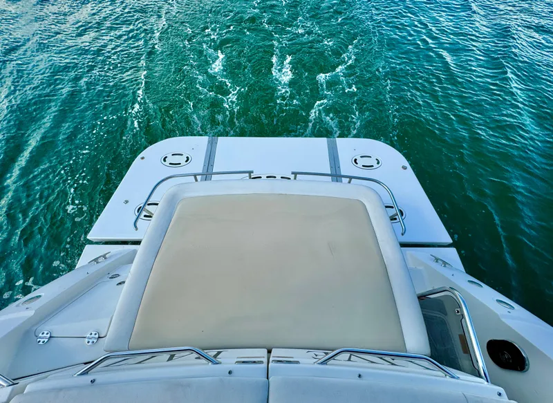 Slide: The Image of Sea Ray 410 Sundancer 2013 yacht cruising on clear blue water. - 9