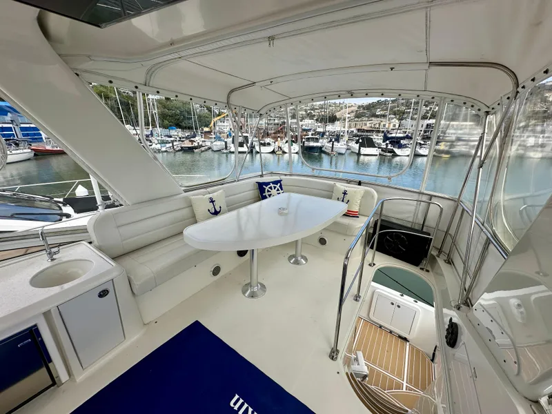 Slide: The Image of Luxurious 2008 Carver 43 Super Sport yacht interior with marina view. - 13