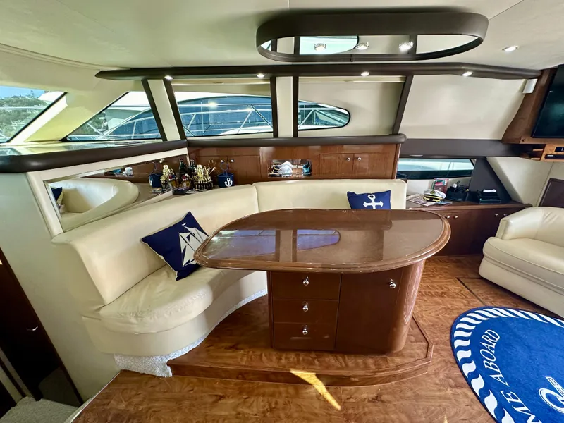 Slide: The Image of Luxurious interior of 2008 Carver 43 Super Sport yacht with elegant seating and nautical decor. - 24