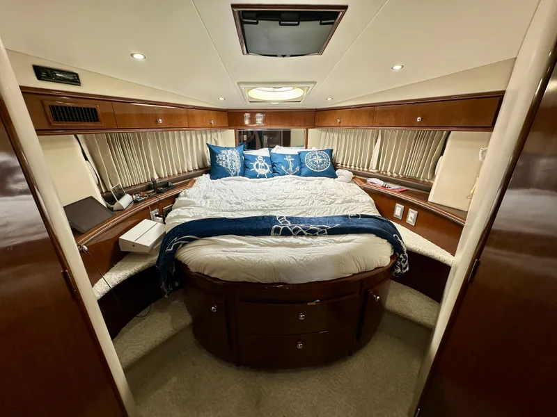 Slide: The Image of Luxurious bedroom interior of 2008 Carver 43 Super Sport yacht with elegant bedding. - 25