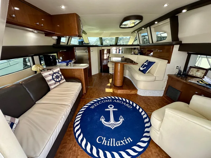 Slide: The Image of Luxurious interior of 2008 Carver 43 Super Sport yacht with nautical decor and plush seating. - 18