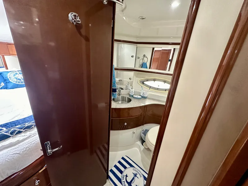 Slide: The Image of 2008 Carver 43 Super Sport yacht bathroom with modern fixtures and nautical decor. - 27