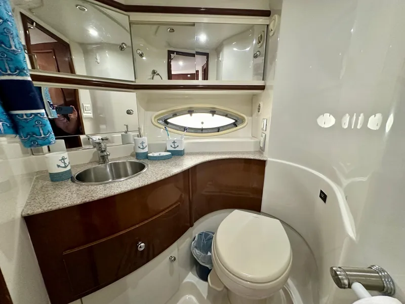 Slide: The Image of Luxurious bathroom in 2008 Carver 43 Super Sport yacht with modern fixtures and nautical decor. - 28