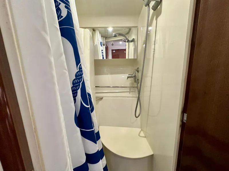 Slide: The Image of Shower area in 2008 Carver 43 Super Sport yacht with blue and white curtain. - 29