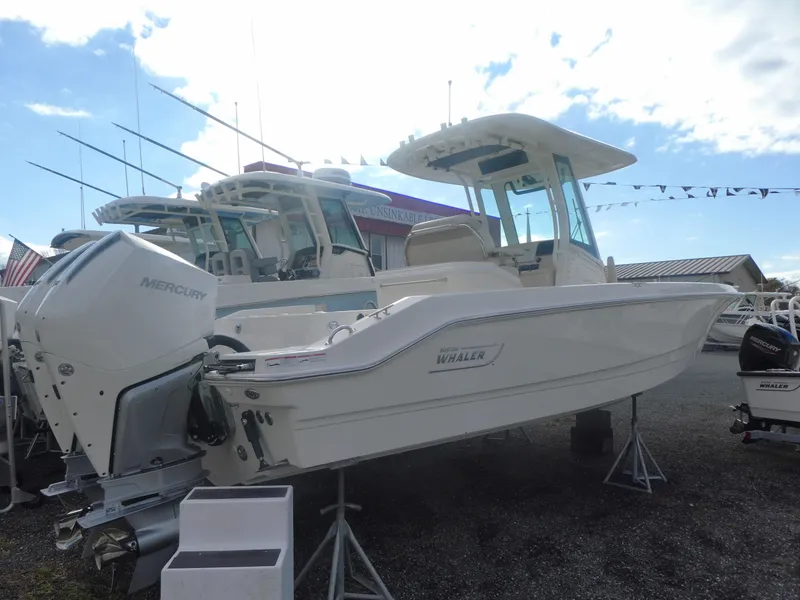 Slide: The Image of 2024 Boston Whaler 280 Dauntless boat with Mercury engine on display. - 3