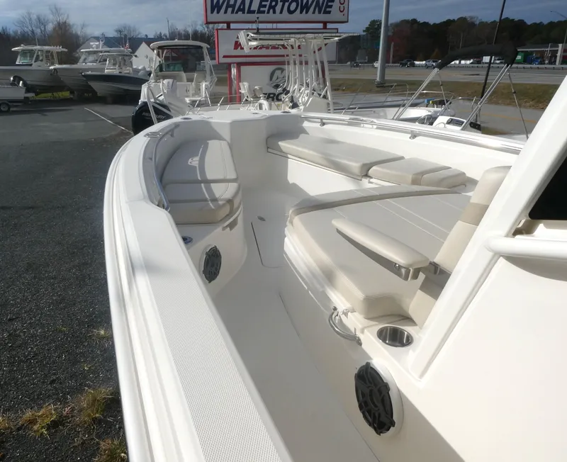 Slide: The Image of 2024 Boston Whaler 280 Dauntless boat interior with seating and cup holders. - 7