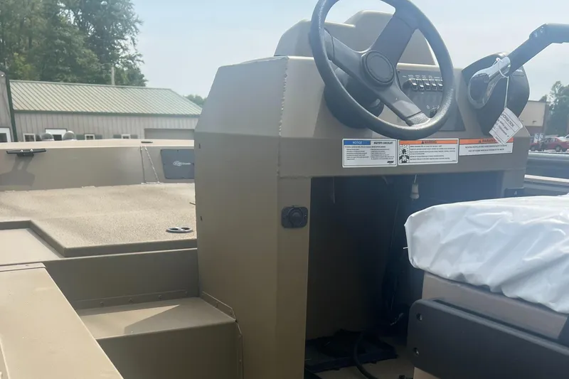 Slide: The Image of 2025 G3 Gator Tough 18 CCJ boat interior with steering console and seating. - 10