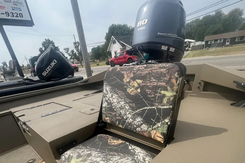 Slide: The Image of 2025 G3 Gator Tough 18 CCJ boat with camo seats and Yamaha 80 engine. - 12