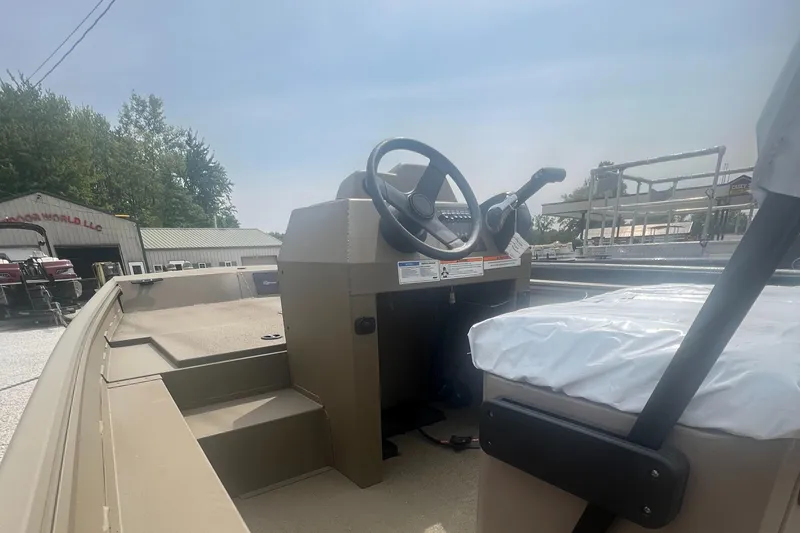 Slide: The Image of 2025 G3 Gator Tough 18 CCJ boat interior with steering wheel and seating. - 14