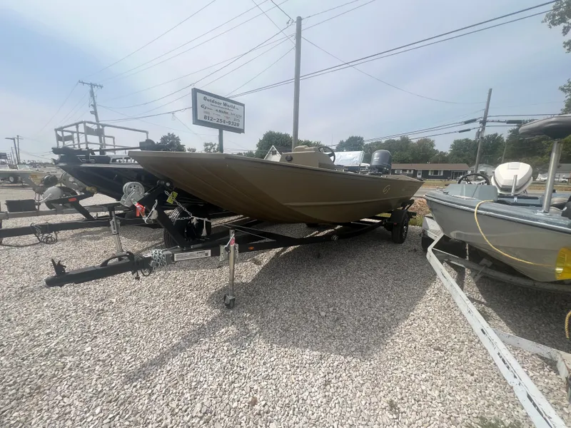 Slide: The Image of 2025 G3 Gator Tough 18 CCJ boat on trailer in outdoor lot. - 8