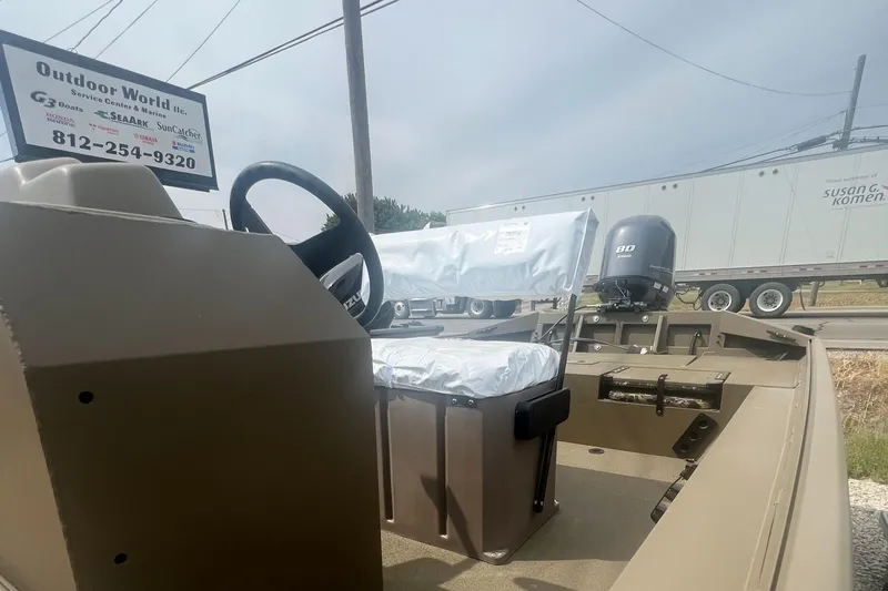 Slide: The Image of 2025 G3 Gator Tough 18 CCJ boat interior with steering wheel and seating. - 9