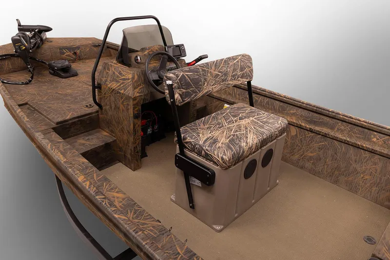Slide: The Image of 2025 G3 Gator Tough 18 CCJ boat interior with steering console and seating. - 2