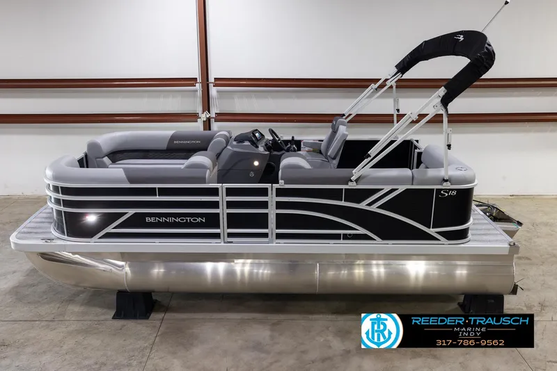 Slide: The Image of 2025 Bennington 188 SLS pontoon boat in showroom, side view. - 1