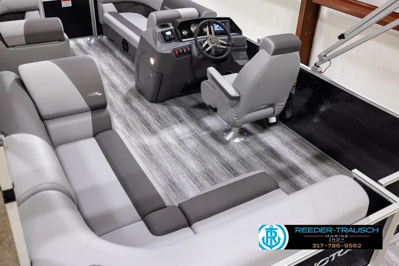Slide: The Image of 2025 Bennington 188 SLS pontoon boat interior with gray seating and modern helm. - 11