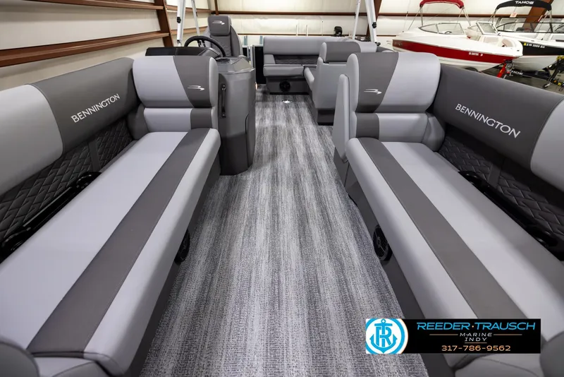 Slide: The Image of 2025 Bennington 188 SLS pontoon boat interior with gray seating and modern design. - 12