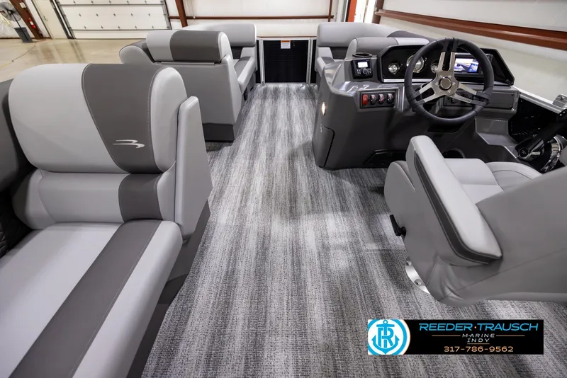 Slide: The Image of 2025 Bennington 188 SLS boat interior with modern seating and steering console. - 15