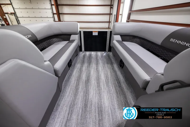 Slide: The Image of 2025 Bennington 188 SLS boat interior with gray seating and carpeted flooring. - 16