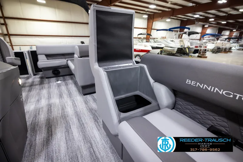 Slide: The Image of Interior of 2025 Bennington 188 SLS pontoon boat with open storage compartment. - 19