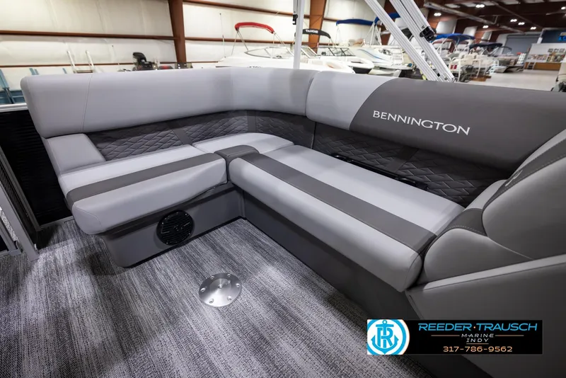 Slide: The Image of 2025 Bennington 188 SLS boat interior with gray seating and logo. - 20