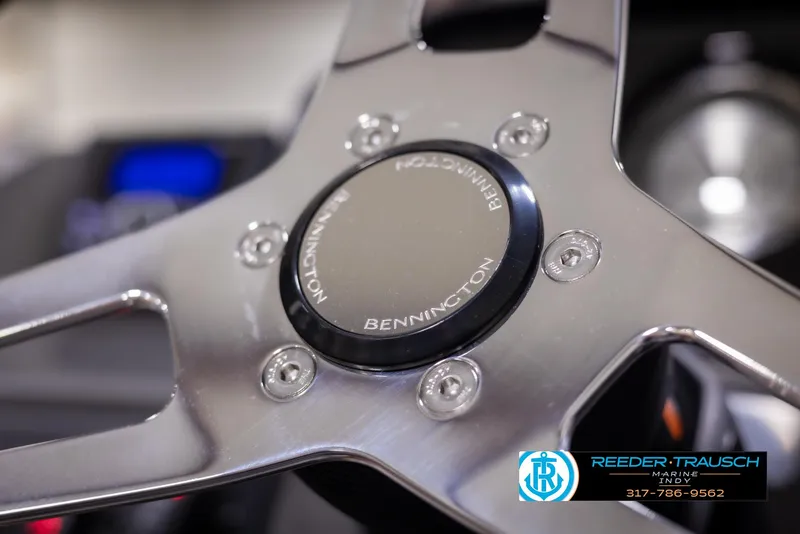 Slide: The Image of Close-up of 2025 Bennington 188 SLS steering wheel with logo and metallic finish. - 26