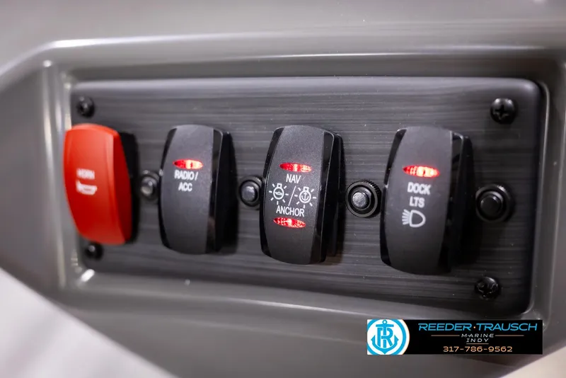 Slide: The Image of Control panel of 2025 Bennington 188 SLS boat with labeled switches. - 27