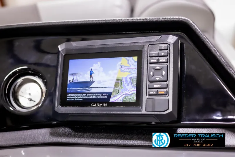 Slide: The Image of Garmin navigation system on 2025 Bennington 188 SLS boat dashboard, Reeder-Trausch logo visible. - 30