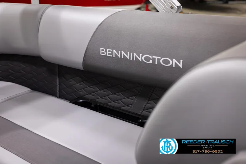 Slide: The Image of 2025 Bennington 188 SLS boat interior with gray seating and logo. - 34