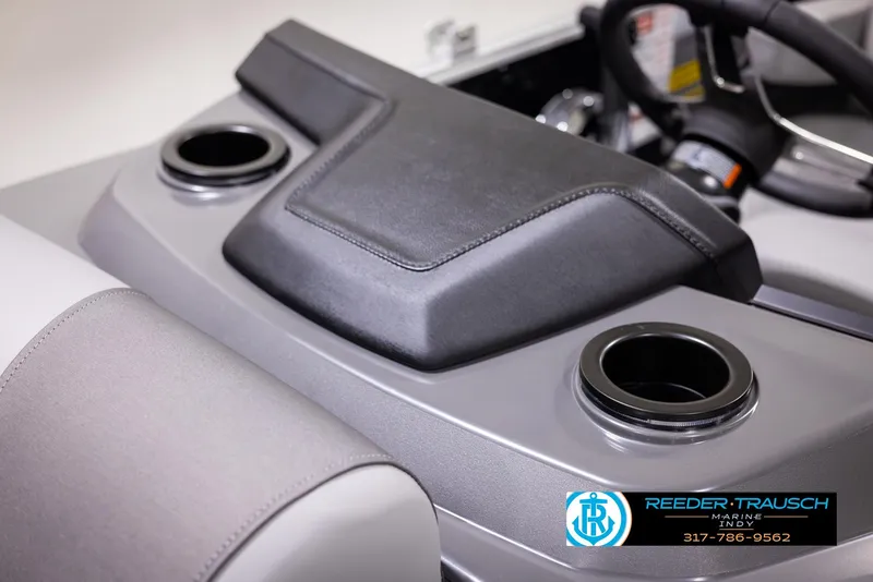 Slide: The Image of 2025 Bennington 188 SLS boat console with cup holders and steering wheel. - 39