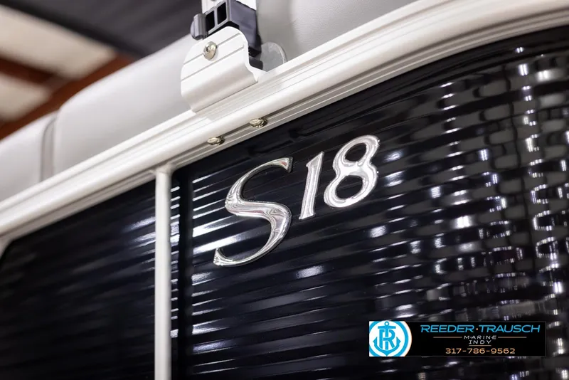 Slide: The Image of Close-up of 2025 Bennington 188 SLS boat model emblem with dealership logo. - 43