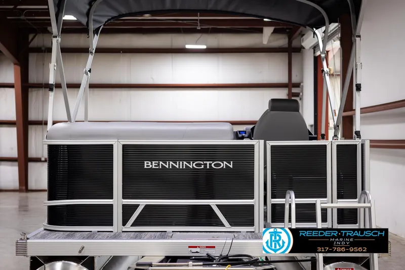 Slide: The Image of 2025 Bennington 188 SLS pontoon boat in showroom, rear view. - 6