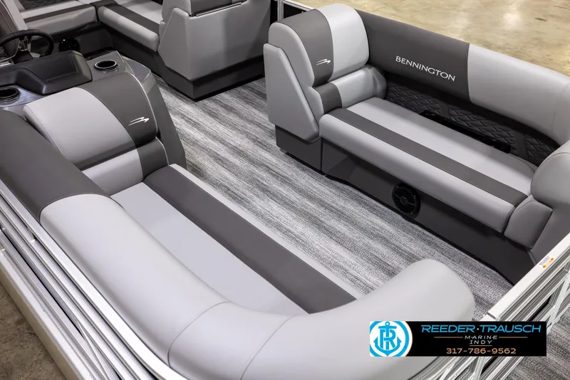 Slide: The Image of 2025 Bennington 188 SLS pontoon boat interior with gray seating and striped flooring. - 9