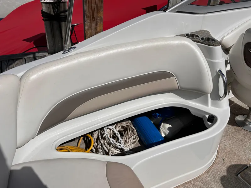 Slide: The Image of 2007 Crownline 255 CCR boat interior storage compartment with ropes and equipment. - 14