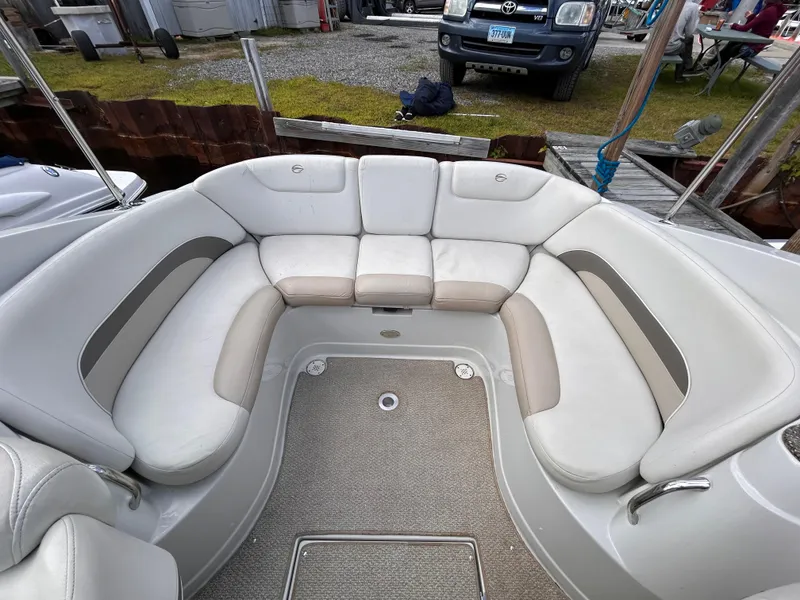 Slide: The Image of 2007 Crownline 255 CCR boat interior with white seating and carpeted floor. - 17