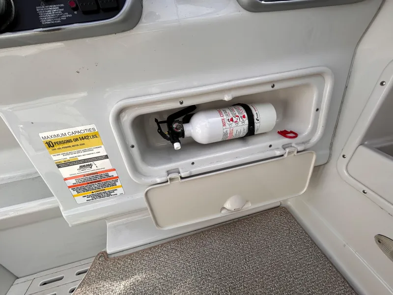 Slide: The Image of 2007 Crownline 255 CCR boat interior with fire extinguisher compartment. - 25