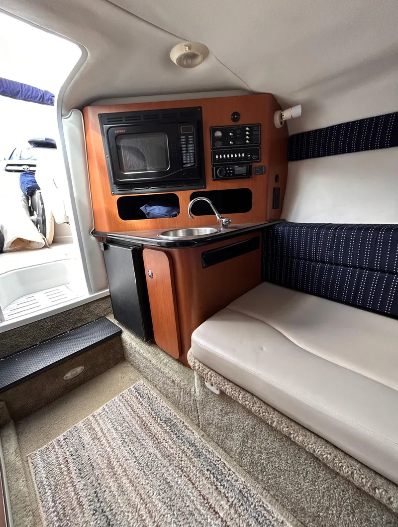 Slide: The Image of 2007 Crownline 255 CCR cabin interior with kitchenette and seating area. - 41