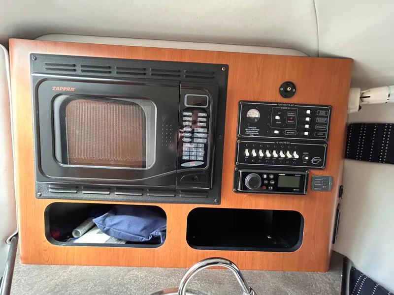 Slide: The Image of 2007 Crownline 255 CCR interior with microwave and control panel. - 43