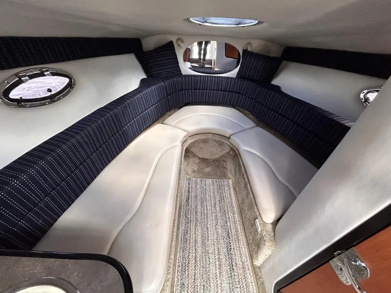 Slide: The Image of Interior cabin of 2007 Crownline 255 CCR boat, featuring comfortable seating and modern design. - 47