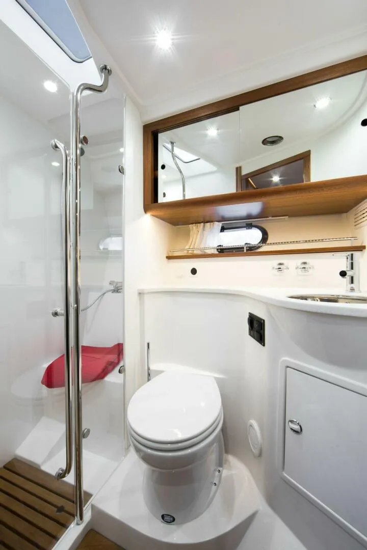 Slide: The Image of Luxurious bathroom in 2024 Nimbus 405 Coupé yacht with modern fixtures and elegant design. - 10