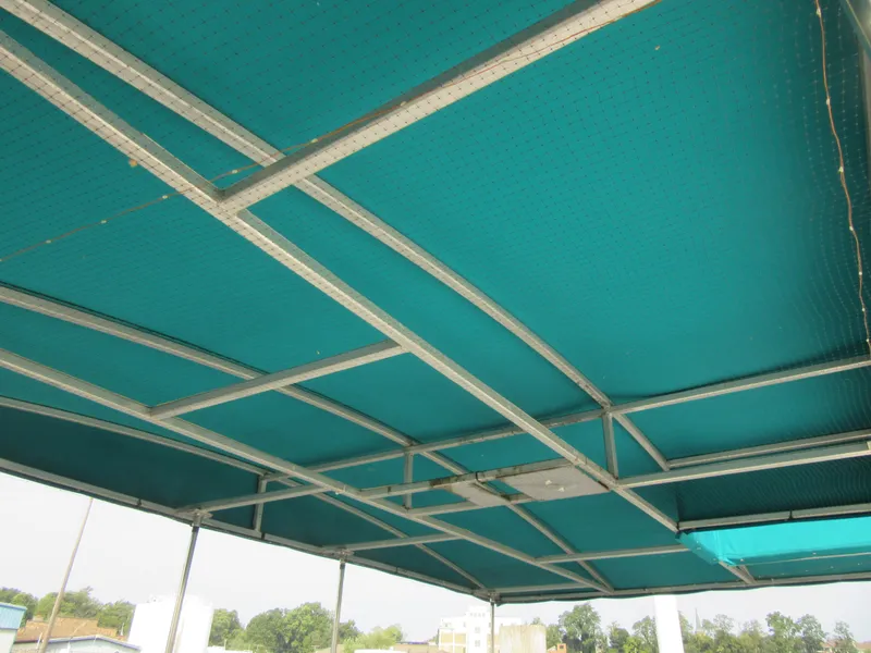 Slide: The Image of Green canopy roof with metal frame, outdoors, under clear sky. - 12