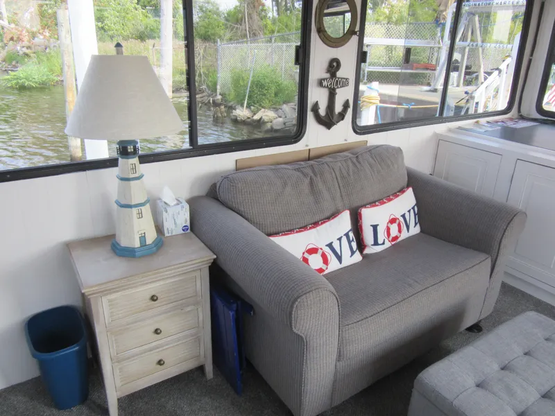 Slide: The Image of Cozy boat interior with loveseat, nautical decor, and lake view. Gibson 44 Classic, 1995. - 36