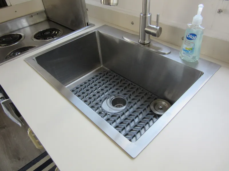 Slide: The Image of Stainless steel kitchen sink with modern faucet and soap dispenser, Gibson 44 Classic, 1995 model. - 38