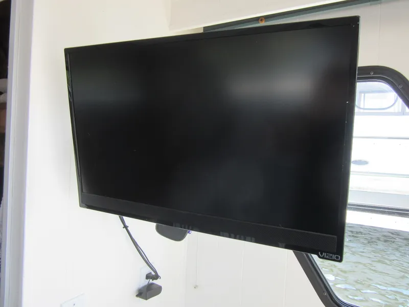 Slide: The Image of Flat-screen Vizio TV mounted on a wall in a bright room. - 45